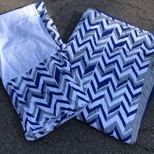 Land of Nod reversible crib quilt and crib skirt